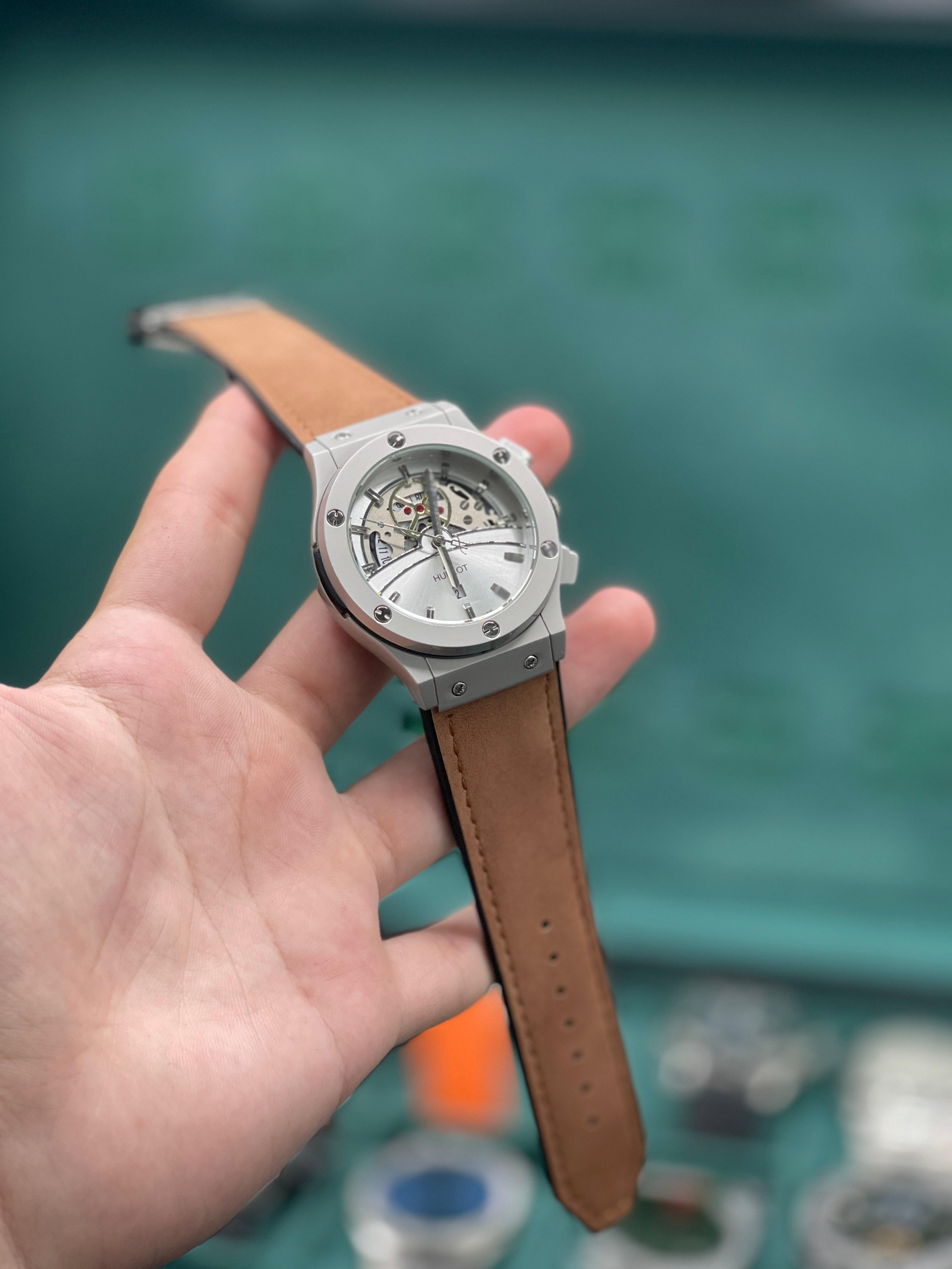 HB Silver Skeleton Dial Chronograph Watch with Matte Gray Case and Brown Leather Strap
