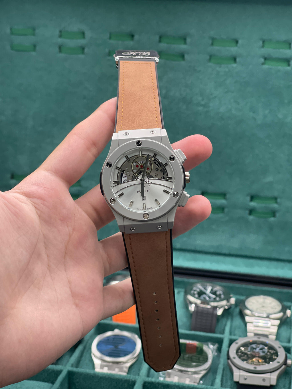 HB Silver Skeleton Dial Chronograph Watch with Matte Gray Case and Brown Leather Strap