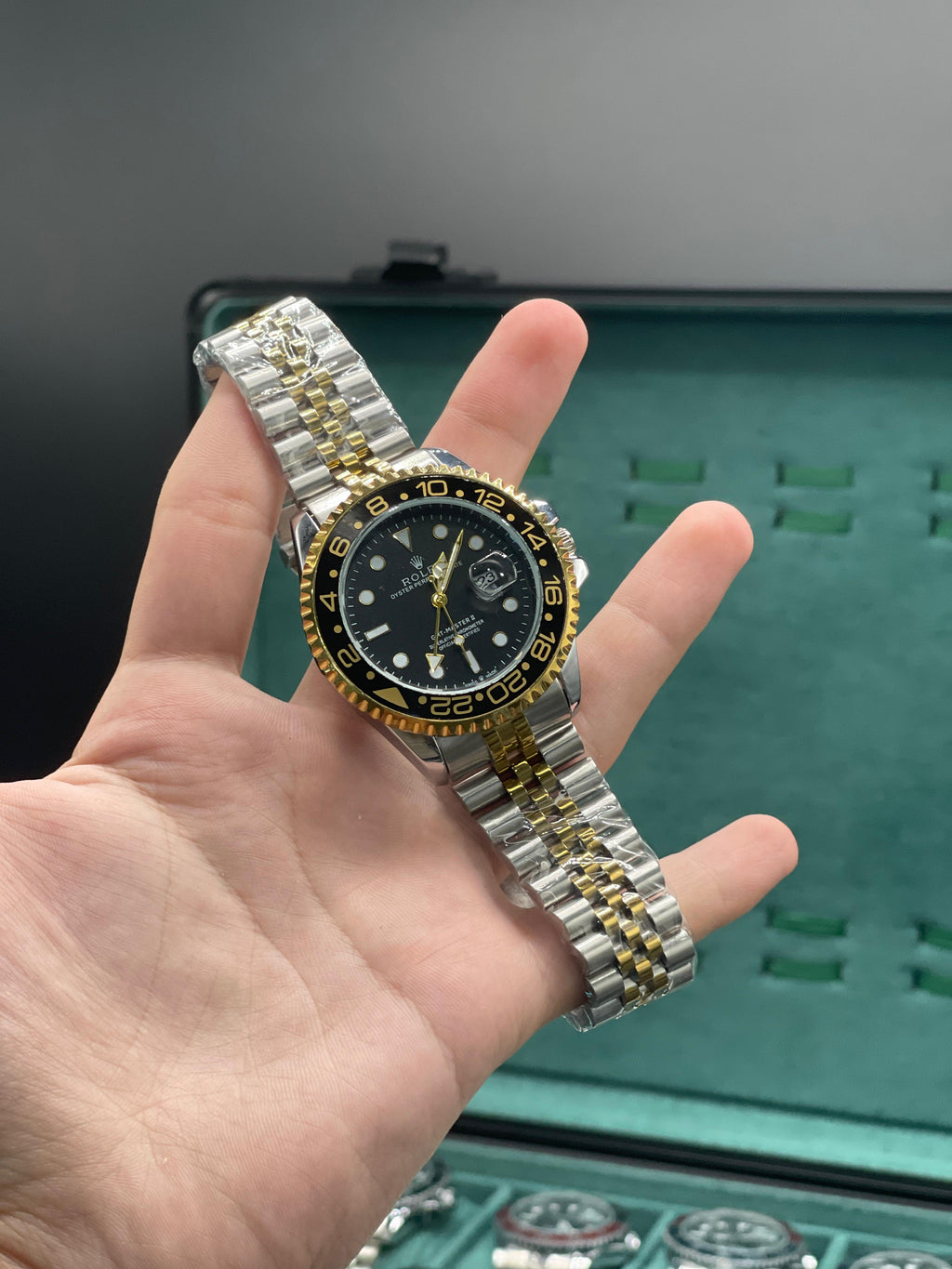 RLX Two-Tone GMT Style Watch with Black Dial, Gold Bezel, and Jubilee Bracelet