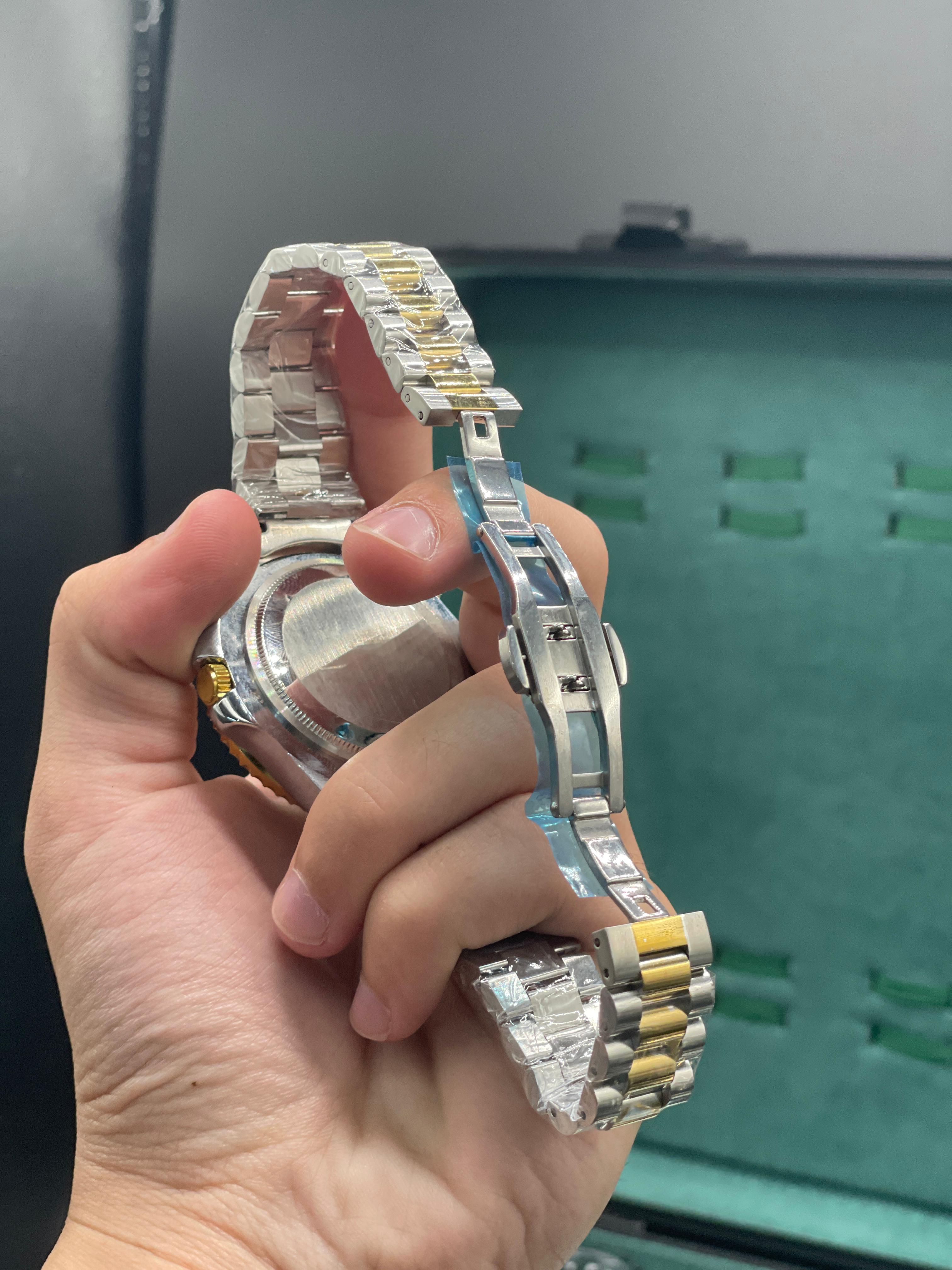 RLX Two-Tone Dive Style Watch with Green Dial, Gold Bezel, and Jubilee Bracelet