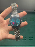 RLX  Stainless Steel Dress Watch with Teal Blue Diamond Dial, Smooth Bezel, and Jubilee Bracelet