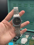 GUCI Stainless Steel Luxury Sports Watch with Black Textured Dial, Integrated Bracelet, and Octagonal Case