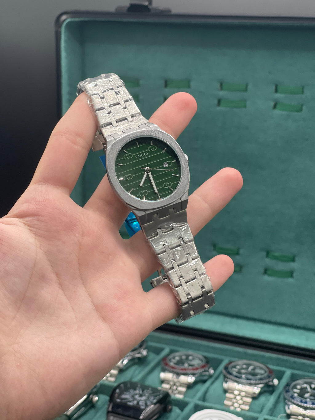 GUCI Stainless Steel Luxury Sports Watch with Black Textured Dial, Integrated Bracelet, and Octagonal Case