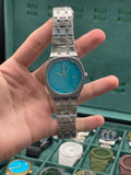 GUCI Stainless Steel Luxury Sports Watch with Turquoise Textured Dial, Integrated Bracelet, and Octagonal Case