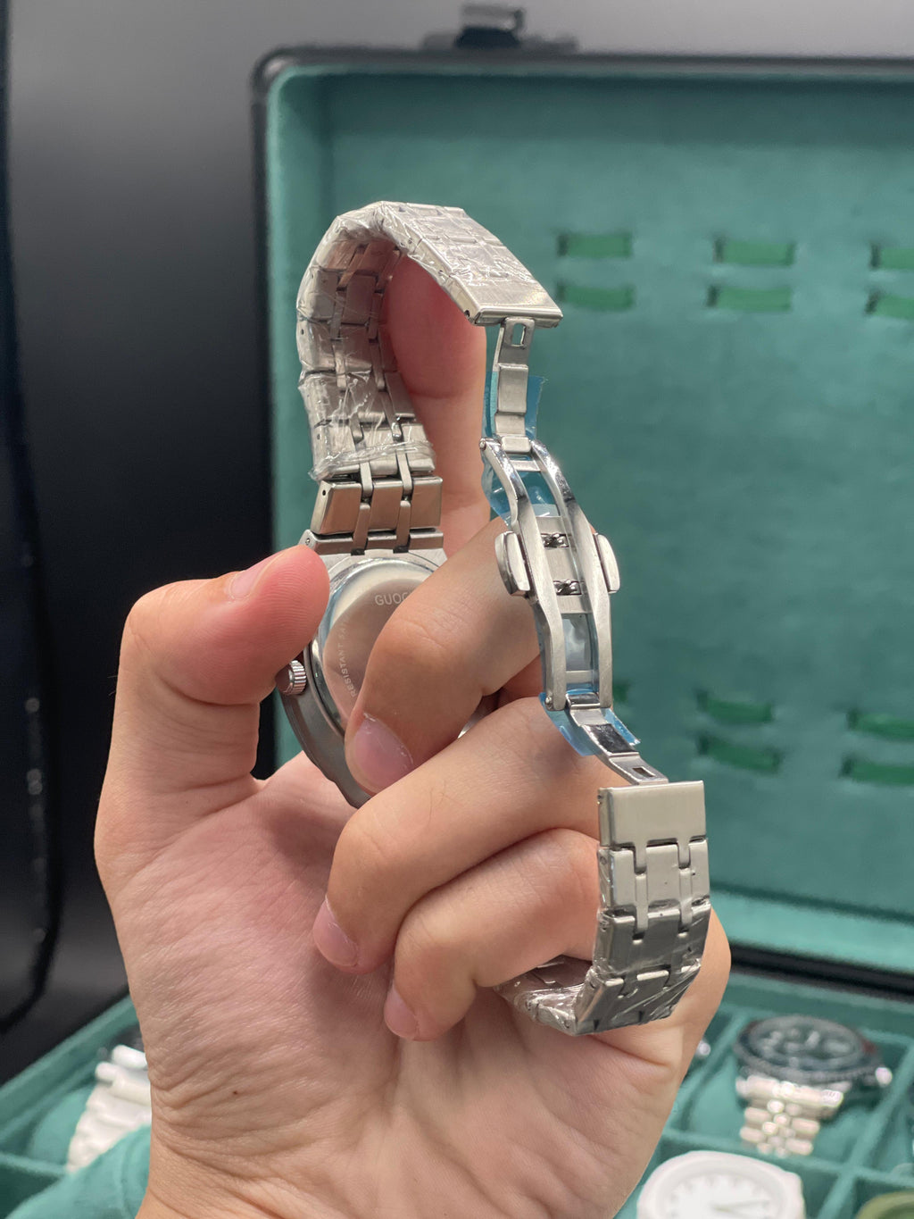 GUCI Stainless Steel Luxury Sports Watch with Turquoise Textured Dial, Integrated Bracelet, and Octagonal Case
