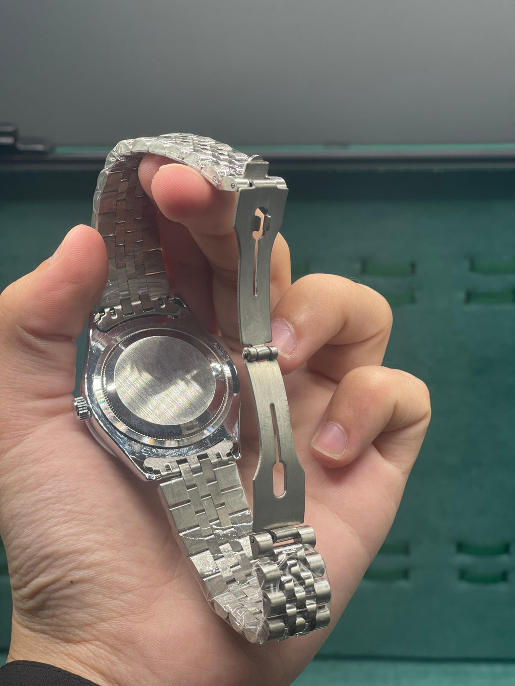 RLX  Stainless Steel Dress Watch with Teal Blue Diamond Dial, Smooth Bezel, and Jubilee Bracelet