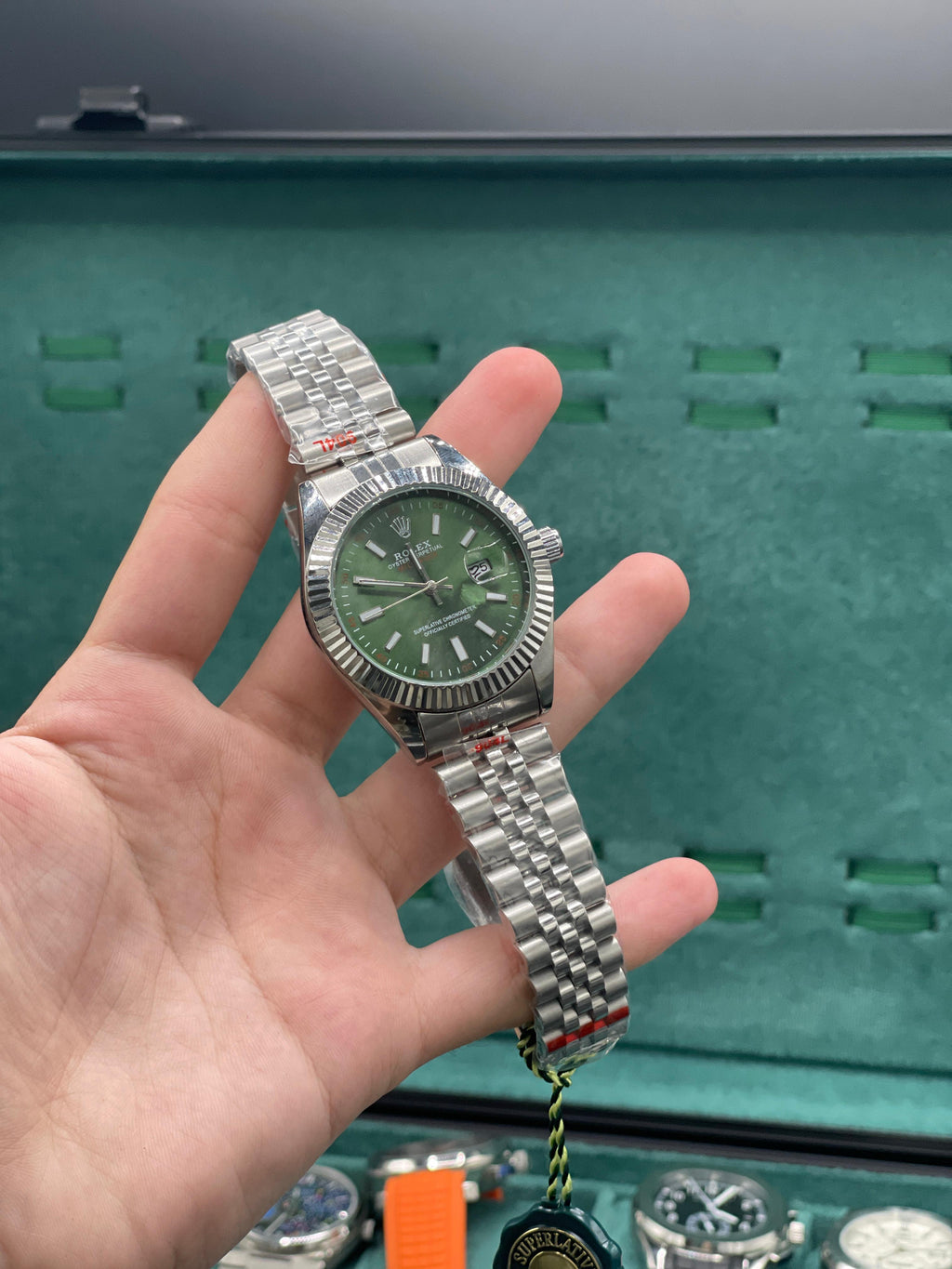 RLX Stainless Steel Luxury Dress Watch with Olive Green Dial, Fluted Bezel, and Jubilee Bracelet